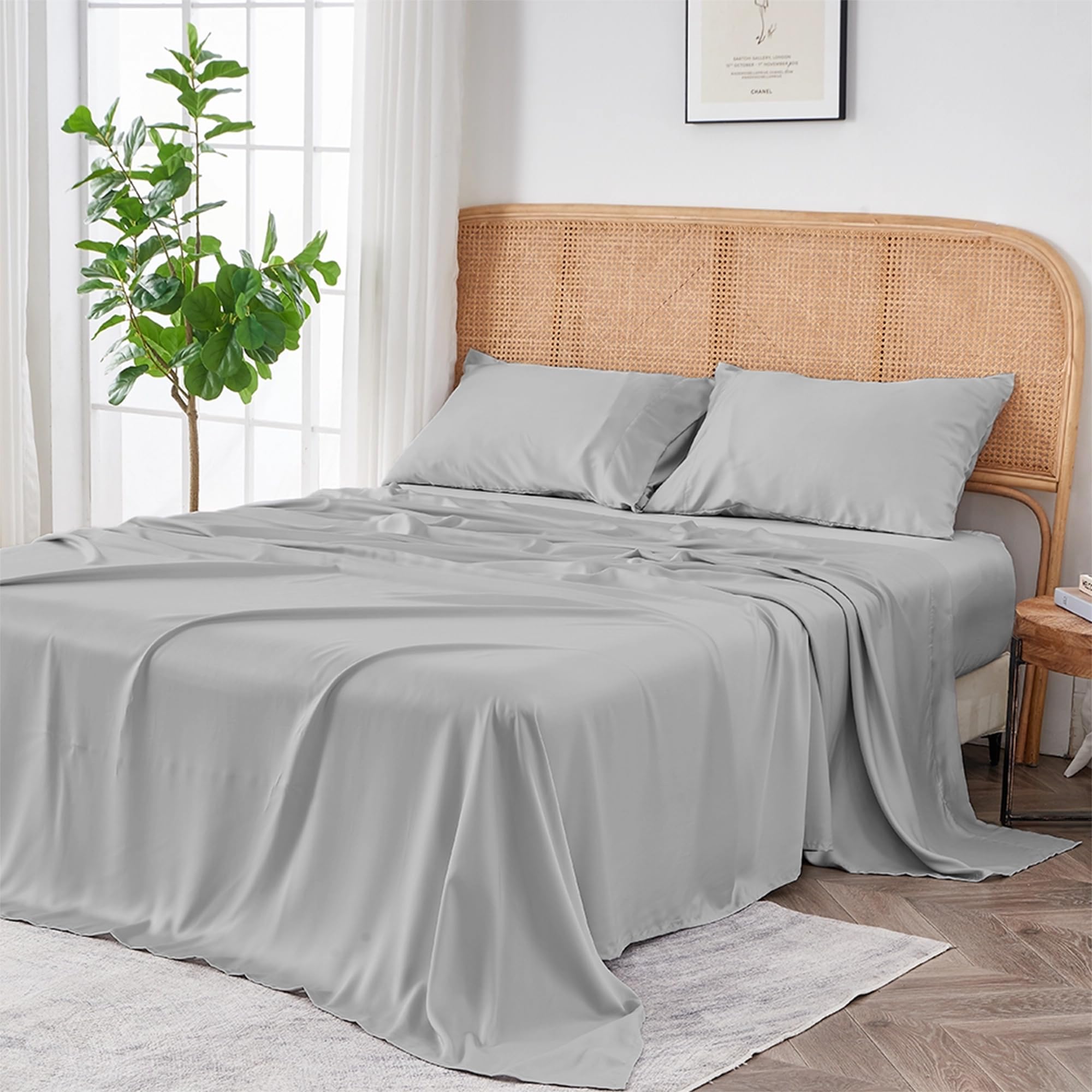 Bedroom scene image brief showing Sijo AiryWeight Eucalyptus Sheet Set on a queen bed in a warm-climate bedroom with fan airflow and thin duvet layer